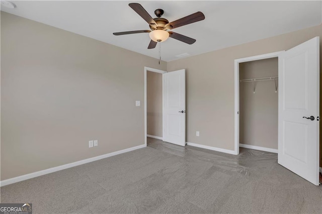 unfurnished bedroom featuring ceiling fan, a closet, and light colored carpet