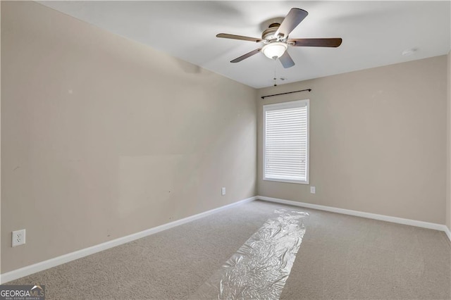 unfurnished room with light carpet and ceiling fan