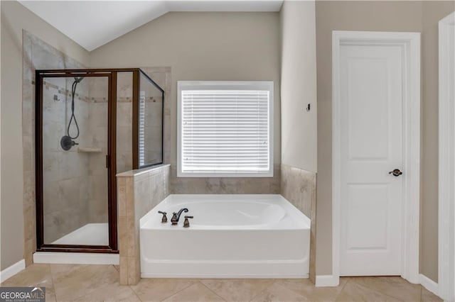 bathroom with tile patterned flooring, lofted ceiling, and independent shower and bath