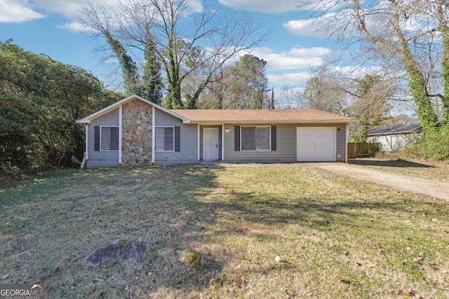 ranch-style home with a garage and a front lawn