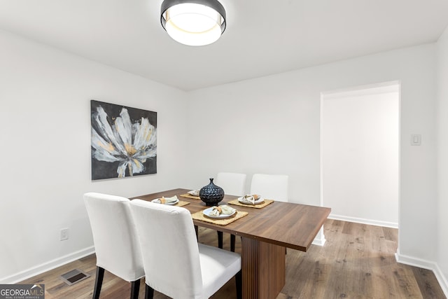 dining area featuring hardwood / wood-style flooring