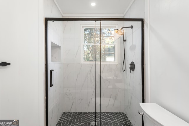 bathroom with toilet and a shower with shower door