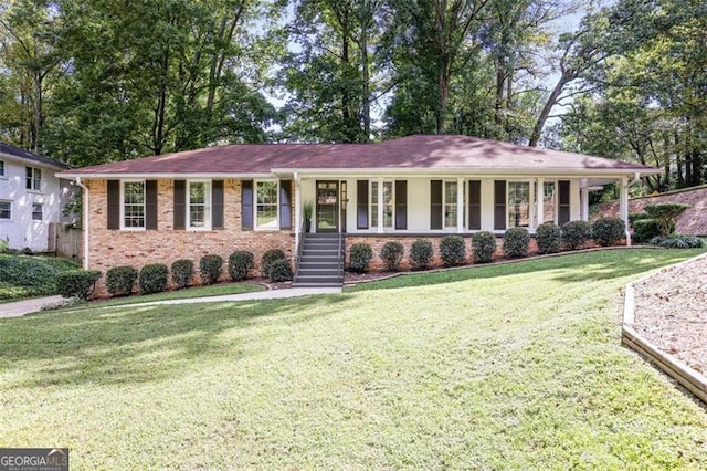 ranch-style house featuring brick siding, a porch, and a front yard