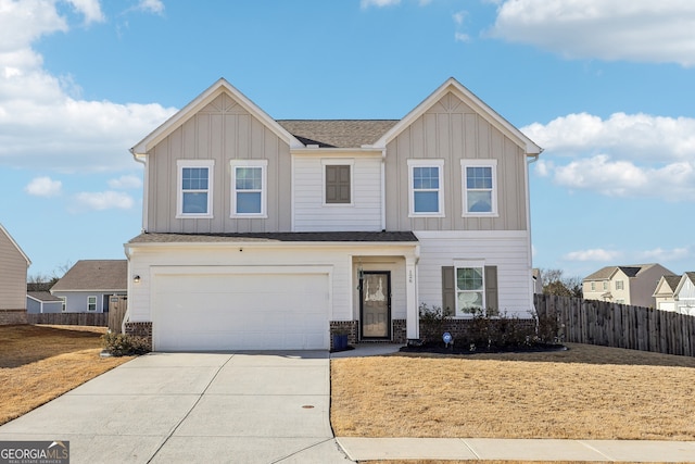 view of front of home with a garage and a front lawn