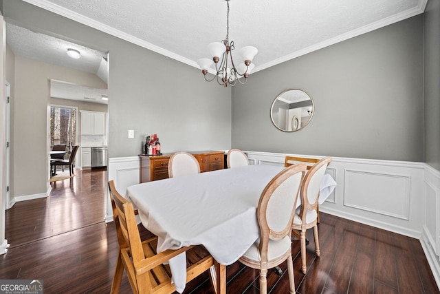 dining space featuring dark hardwood / wood-style floors and crown molding