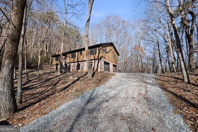 view of side of home with a garage