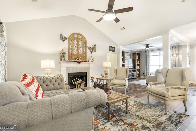 104 Red Fox Run, Dublin, GA 31021 - living room with ceiling fan, wood finished floors, a tile fireplace, decorative columns, and high vaulted ceiling