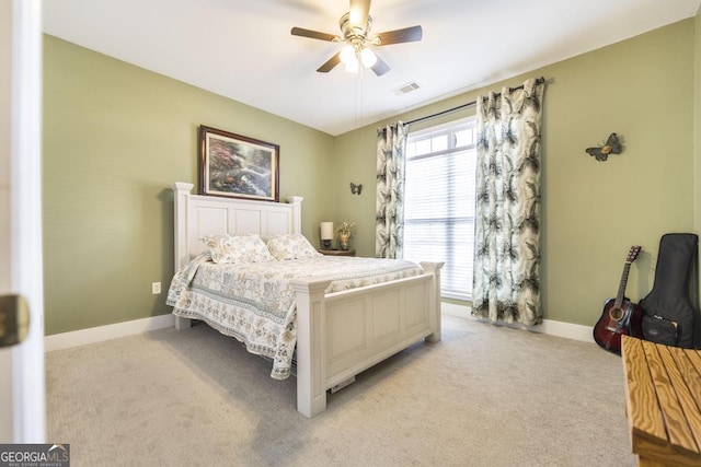 bedroom with light carpet, baseboards, and ceiling fan