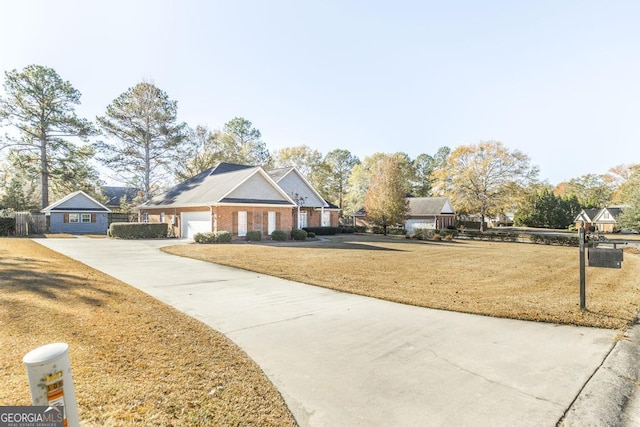 view of front of house featuring a front yard and a garage