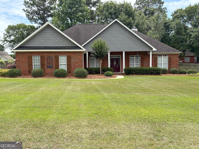 104 Red Fox Run, Dublin, GA 31021 - view of front of home with brick siding, a chimney, and a shingled roof