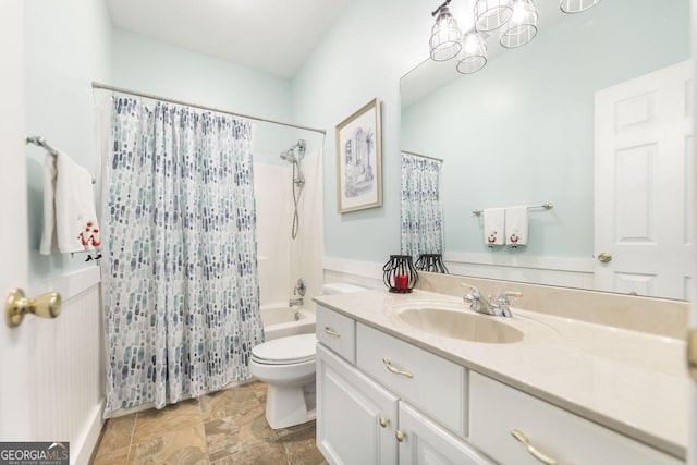 full bathroom featuring shower / tub combo, vanity, and toilet