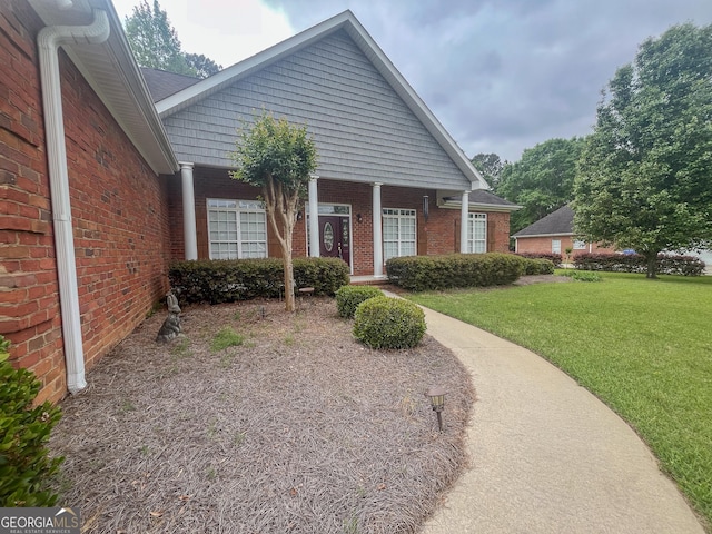 104 Red Fox Run, Dublin, GA 31021 - view of front of house with brick siding and a front lawn
