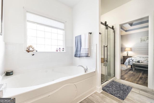 bathroom with wood-type flooring and plus walk in shower