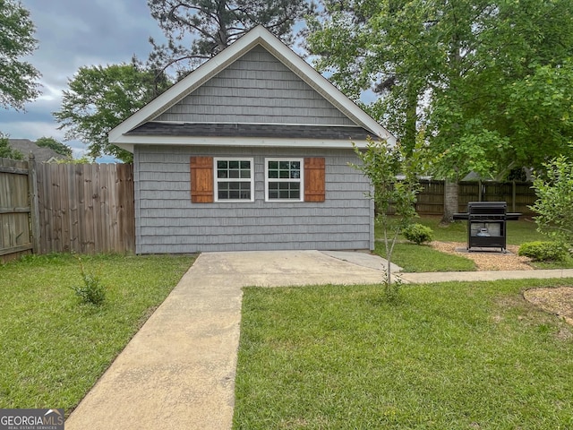 104 Red Fox Run, Dublin, GA 31021 - view of front facade with an outdoor structure and roof with shingles