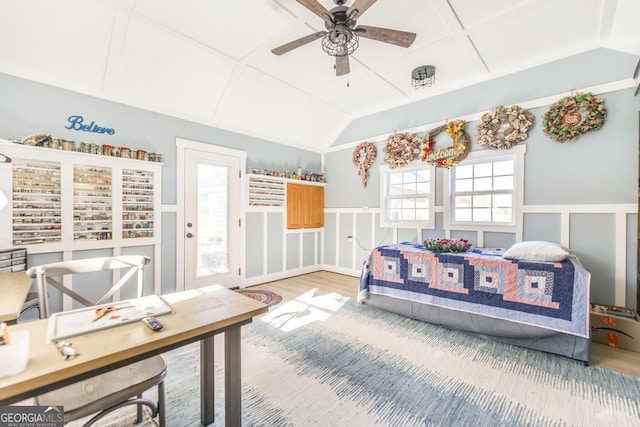 104 Red Fox Run, Dublin, GA 31021 - bedroom with light wood-style floors, lofted ceiling, wainscoting, and a decorative wall
