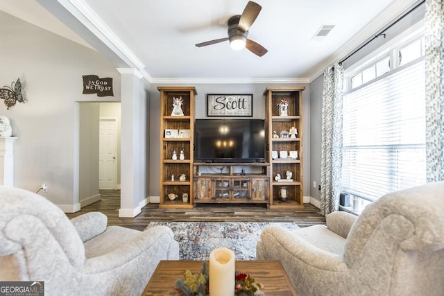 living room featuring ceiling fan, dark hardwood / wood-style flooring, crown molding, and a wealth of natural light