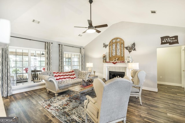 living area with ceiling fan, wood finished floors, a fireplace, baseboards, and high vaulted ceiling