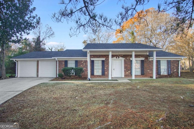 ranch-style home featuring a garage and a front yard