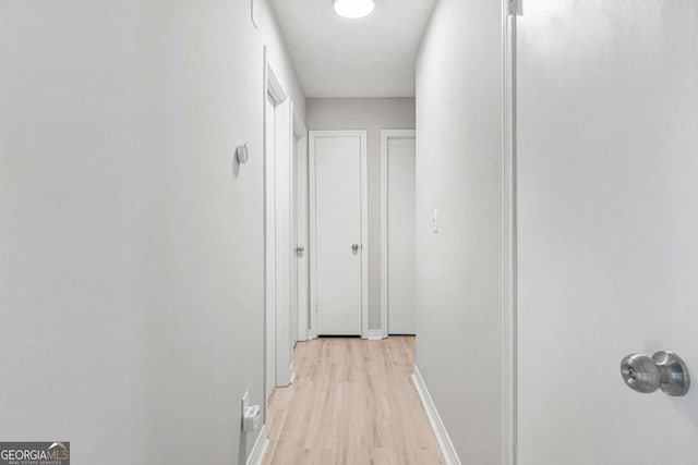 corridor featuring light hardwood / wood-style flooring