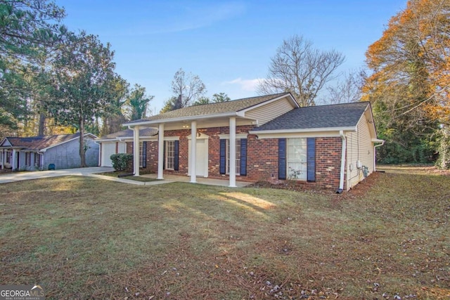 single story home featuring a front lawn and a garage