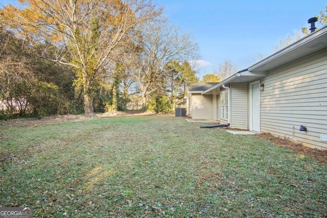 view of yard featuring central air condition unit