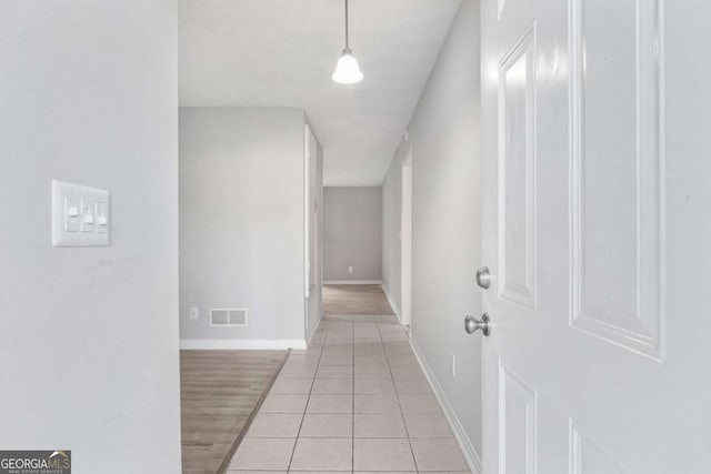 corridor featuring light hardwood / wood-style flooring