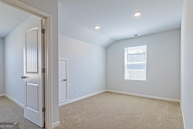 bonus room featuring carpet flooring and vaulted ceiling