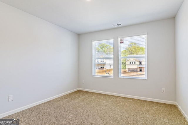 spare room featuring carpet floors