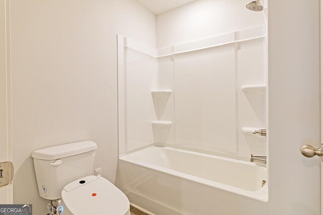 bathroom with toilet and tub / shower combination