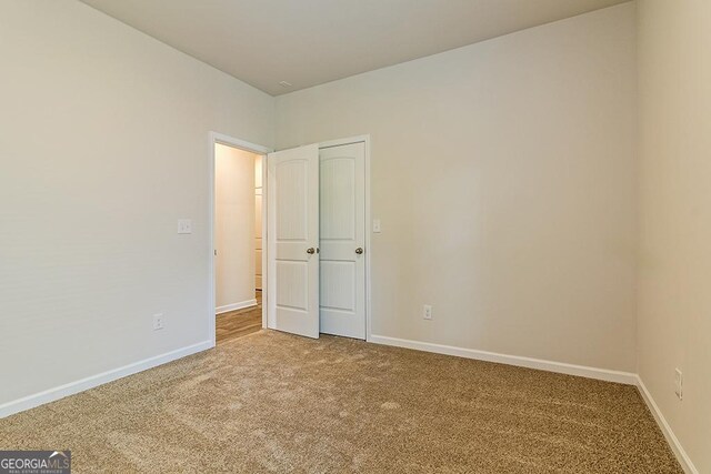 empty room with carpet flooring