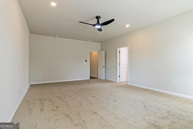 unfurnished bedroom featuring ceiling fan and carpet