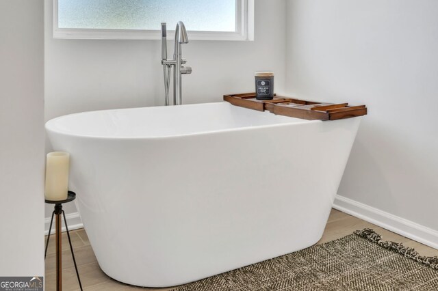 room details with a tub to relax in and sink