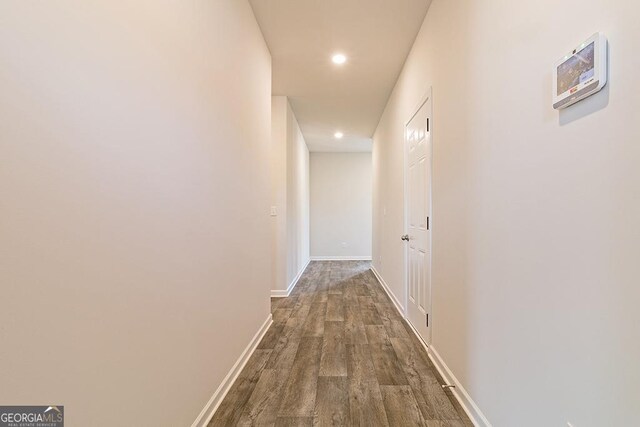 hall with dark hardwood / wood-style flooring