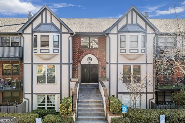6851 Roswell Rd Unit D14, Atlanta, GA 30328 - view of front of property featuring stucco siding and a shingled roof