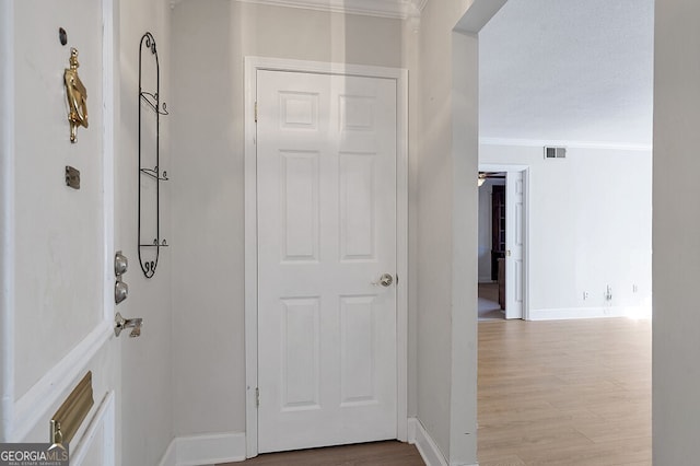 6851 Roswell Rd Unit D14, Atlanta, GA 30328 - hallway with wood finished floors and ornamental molding