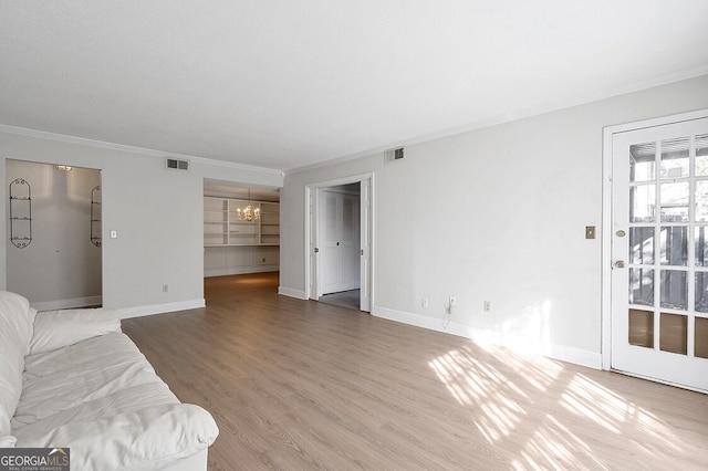 6851 Roswell Rd Unit D14, Atlanta, GA 30328 - unfurnished living room with a chandelier, crown molding, and wood finished floors