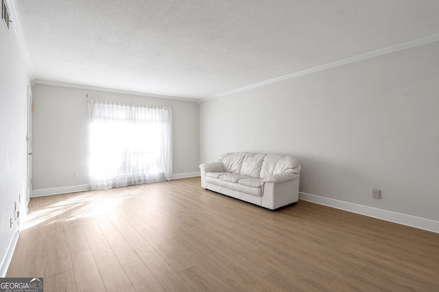 6851 Roswell Rd Unit D14, Atlanta, GA 30328 - unfurnished room featuring crown molding, wood finished floors, and a textured ceiling