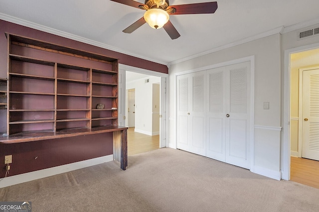 6851 Roswell Rd Unit D14, Atlanta, GA 30328 - unfurnished bedroom featuring crown molding, carpet, a closet, and ceiling fan