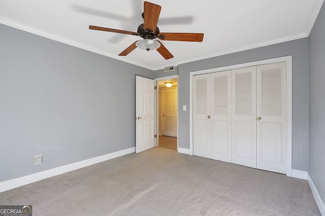 6851 Roswell Rd Unit D14, Atlanta, GA 30328 - unfurnished bedroom featuring carpet, crown molding, a closet, and a ceiling fan