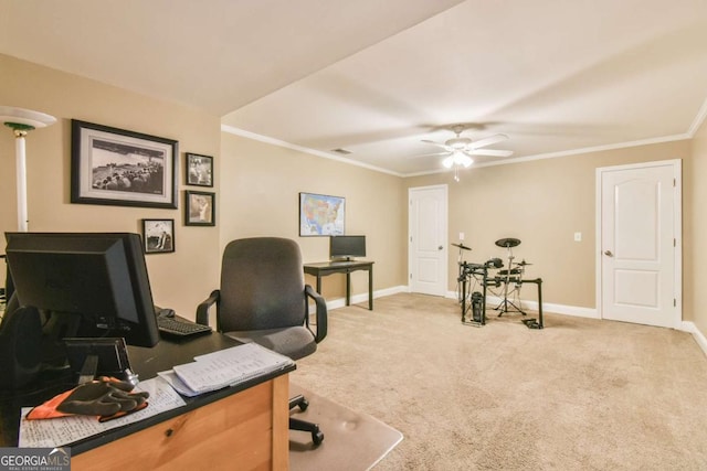 home office with carpet flooring, ceiling fan, and ornamental molding