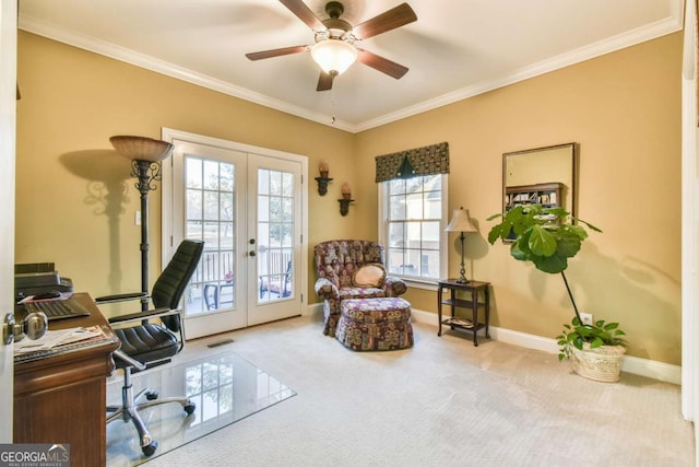 carpeted office space with ceiling fan, crown molding, and french doors