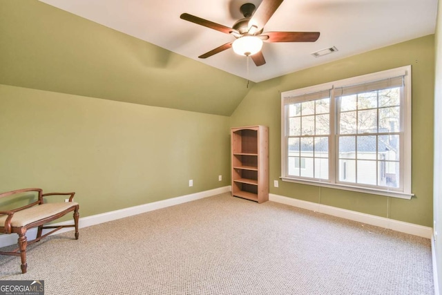 sitting room with light colored carpet, ceiling fan, and lofted ceiling