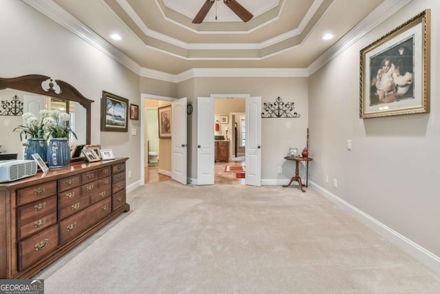 carpeted bedroom featuring ensuite bathroom, ceiling fan, and ornamental molding