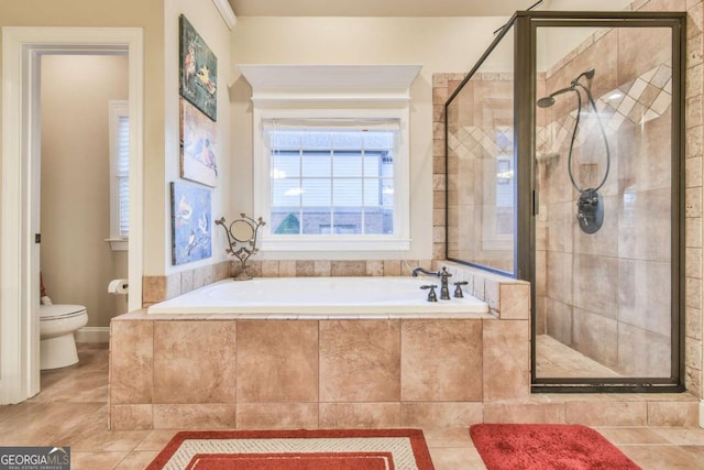 bathroom featuring tile patterned floors, independent shower and bath, and toilet