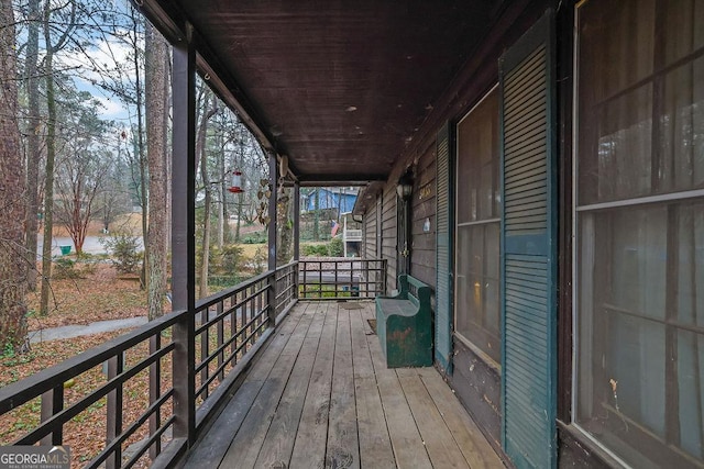 wooden deck with a water view