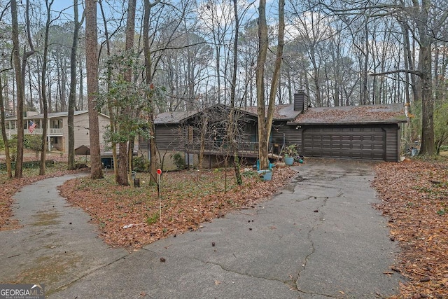 ranch-style home featuring a garage