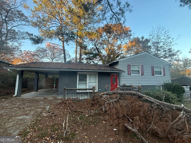 view of front facade with a carport