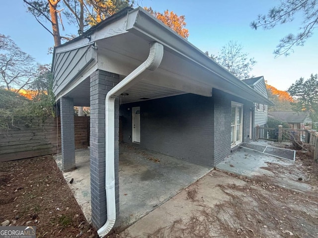 view of side of home with a patio