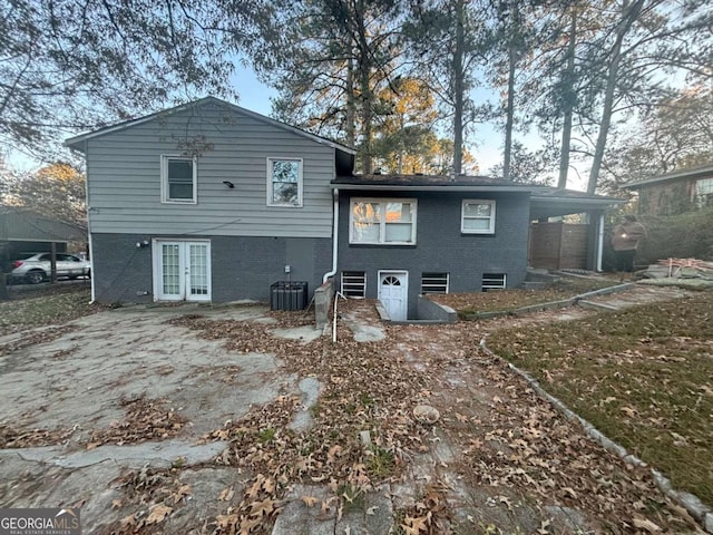 back of property featuring central air condition unit and french doors