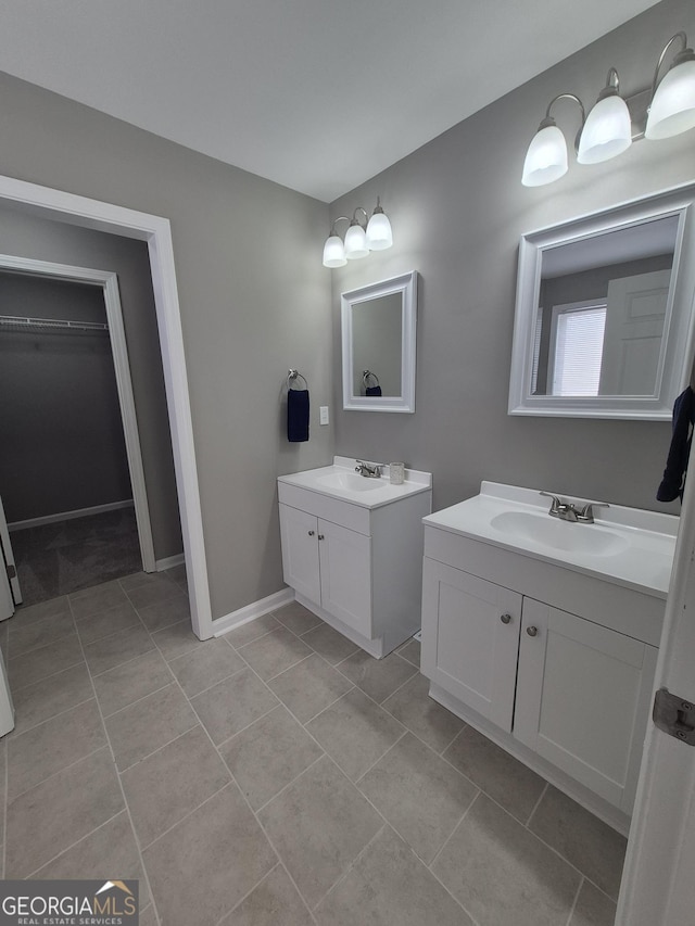 bathroom featuring tile patterned flooring and vanity